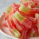 Homemade Watermelon Rind Candy with vibrant green and pink colors