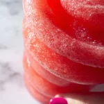 Refreshing watermelon slushies in a glass with mint garnish