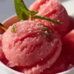 Delicious bowl of homemade watermelon sorbet served in a glass dish.