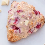 Brunch-ready white chocolate raspberry scones on a plate