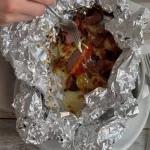 Cajun campsite foil pack for a quick campfire dinner