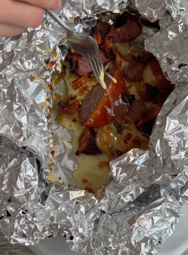 Cajun campsite foil pack for a quick campfire dinner