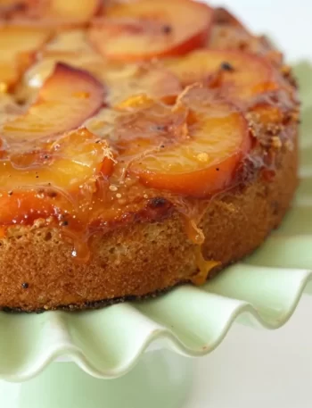 Delicious nectarine upside-down cake served on a plate