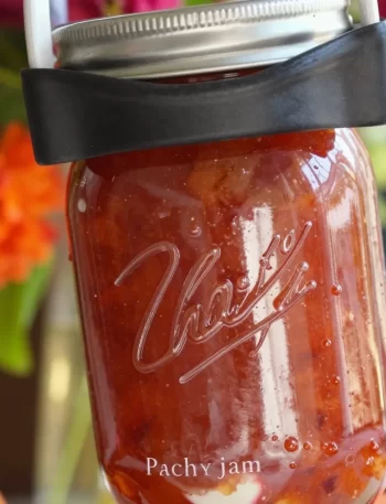 Easy honey-sweetened strawberry peach jam in a jar