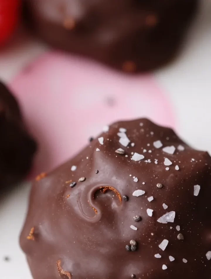 No-bake raspberry chocolate bites arranged on a plate, ready to eat.