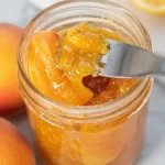 Homemade peach jam made with fresh ingredients in a jar