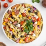 A vibrant bowl of Minute Italian Pasta Salad with fresh veggies and zesty dressing