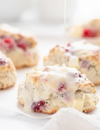 Freshly baked lemon raspberry scones on a plate for brunch.