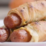 Plate of Minute Pigs in a Blanket served as easy appetizers.