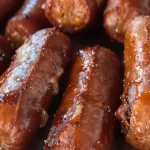 One-Pan Sticky-Sweet Baked Hot Dog Burnt Ends served on a plate