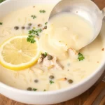 Creamy lemon chicken orzo soup in a pot, perfect for cozy weeknight meals