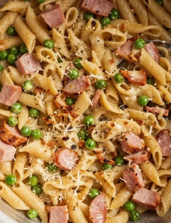 One-Pot Ham and Pea Pasta dish garnished with herbs