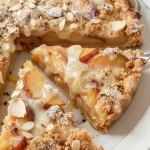 Delicious summer nectarine crumb tart with golden crumb topping