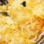 Freshly baked Tomato Pie with tomatoes and herbs in a golden crust