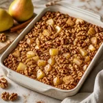 Meal-prep pear and walnut baked oats ready for a nutritious breakfast.