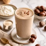 High-Protein Chestnut Vanilla Velvet Smoothie in a glass with toppings