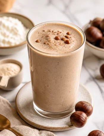High-Protein Chestnut Vanilla Velvet Smoothie in a glass with toppings