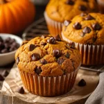 Delicious one-bowl pumpkin chocolate chip muffins fresh from the oven