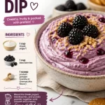 Protein blackberry cheesecake dip served in a bowl with fresh blackberries on top